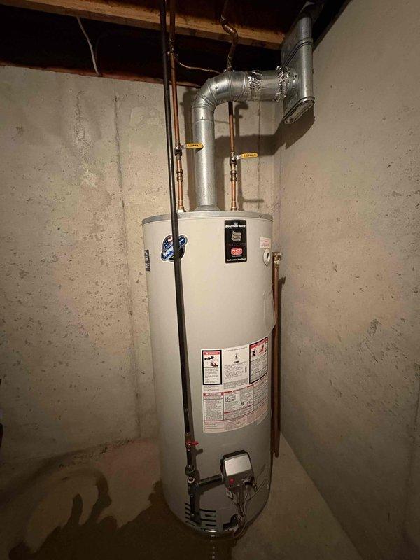 Responded to emergency call for a leaking water heater approximately 10 years old. Upon inspection, identified deterioration at tank bottom causing active water leakage. Recommended full unit replacement due to age and extent of damage, as repair would not be cost-effective. Provided customer with information on replacement options and temporary measures to minimize water damage until replacement can be scheduled.