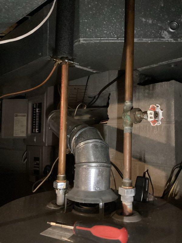 Responded to a leaking 10-year-old Rheem Performance water heater in a basement utility room. Inspected connections and piping system, identifying source of leak. Recommended replacement due to age and condition of unit.