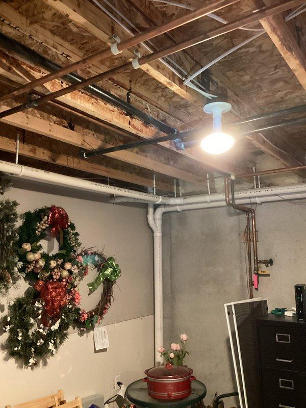 Inspected residential heating system in unfinished basement. Identified issue with copper supply lines and circulation valve (blue handle). Repaired valve functionality and restored proper heat flow to residence.