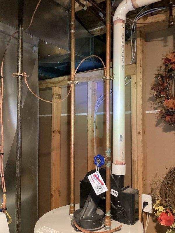 Inspected residential heating system in unfinished basement. Identified issue with copper supply lines and circulation valve (blue handle). Repaired valve functionality and restored proper heat flow to residence.