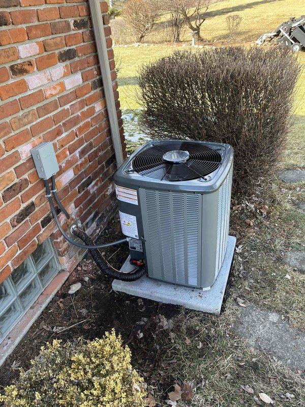 Successfully installed new furnace and air conditioning system in residential property, with proper connections to existing ductwork and electrical systems. New AC unit was properly mounted on concrete pad with appropriate refrigerant and power lines, while furnace installation included proper PVC ventilation components and condensate drainage setup.