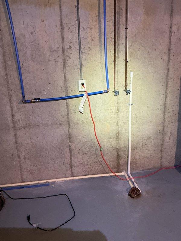 Completed an on-site assessment for a plumbing project estimate in an unfinished basement. Documented existing plumbing infrastructure including PVC drainage system connected to sump pump basin, blue PEX water supply lines, and copper piping. Client requested updated quote for plumbing work; comprehensive photos were taken of the installation area to facilitate accurate estimation.