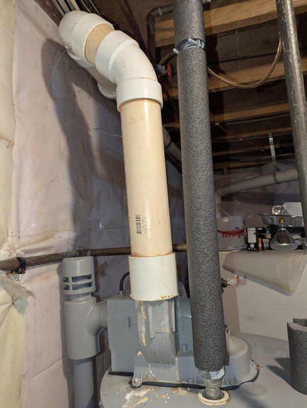 Inspected PowerFlex FVIR Power Vented propane water heater (Model PVG6240T4PV, Serial 0745100105) installed in 2008. Observed deterioration at PVC drain pipe connections and evaluated plumbing infrastructure including valve functionality and insulation integrity on adjacent piping. Recommended replacement of aging unit due to significant wear and potential safety concerns.