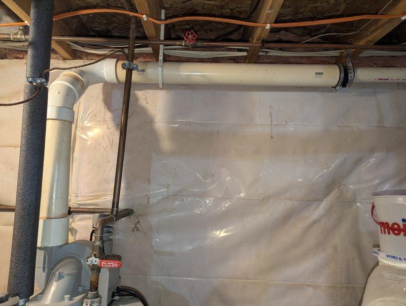 Inspected PowerFlex FVIR Power Vented propane water heater (Model PVG6240T4PV, Serial 0745100105) installed in 2008. Observed deterioration at PVC drain pipe connections and evaluated plumbing infrastructure including valve functionality and insulation integrity on adjacent piping. Recommended replacement of aging unit due to significant wear and potential safety concerns.