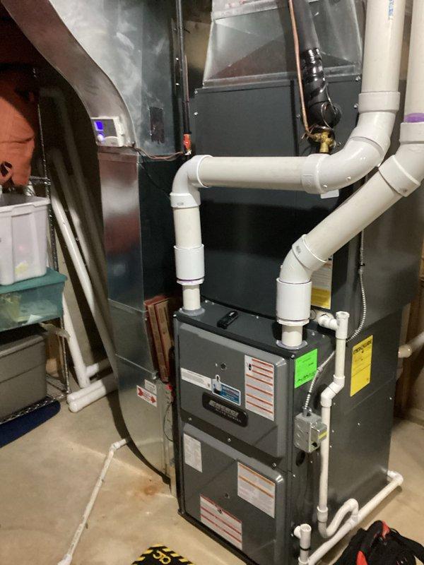 Completed annual heating maintenance on a 6-year-old Energi furnace (warranty valid until 4/2029) with connected humidifier. System inspection revealed properly functioning components with all connections secure. Digital control panel operating normally with no error codes present. Cleaned and inspected furnace and humidification system as part of club membership service.