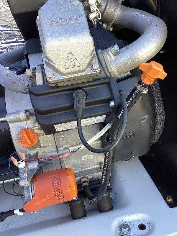 Performed scheduled 2-year tune-up service on Generac generator (circa 2015 model). Inspected engine components, including exhaust system and connection points, with particular attention to valve assembly and fluid lines. All mechanical components were found in good working condition with no signs of deterioration or damage.