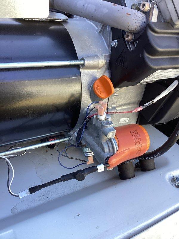 Performed scheduled 2-year tune-up service on Generac generator (circa 2015 model). Inspected engine components, including exhaust system and connection points, with particular attention to valve assembly and fluid lines. All mechanical components were found in good working condition with no signs of deterioration or damage.