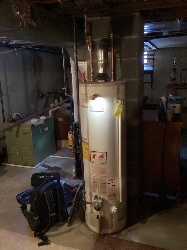 Completed annual maintenance service on 10-year-old EnergiAir furnace. Performed comprehensive tune-up, inspected all components, and verified proper system operation. No humidifier present; took documentation photos of equipment and surrounding mechanical room for service records.