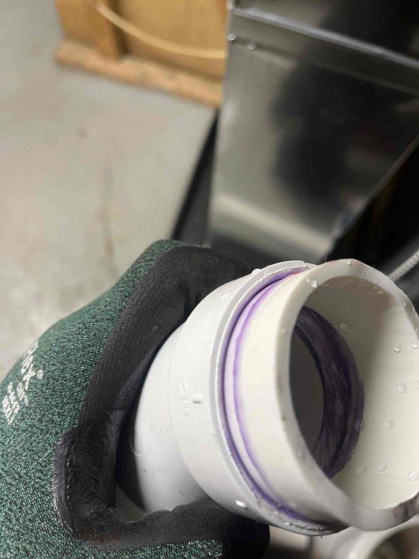 Fixed leaking exhaust pipe on Energi 2 pipe 90+ furnace. Applied PVC primer and sealant to compromised connection point. Verified proper drainage and confirmed furnace is now operating correctly without water leakage.