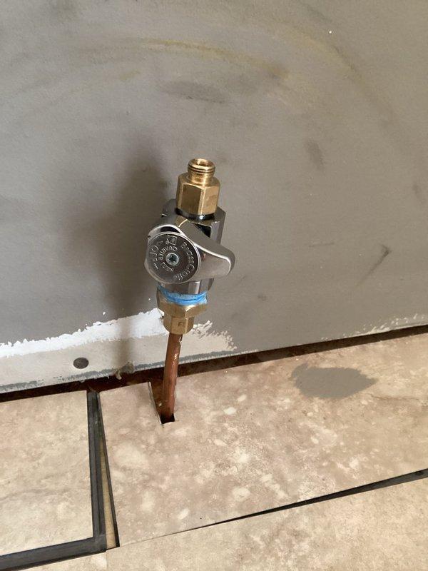 Installed new water shutoff valve for refrigerator water line. Connected valve to existing copper water line that previously had no shutoff capability, enabling proper installation of customer's new refrigerator. Verified proper operation with no leaks after installation.