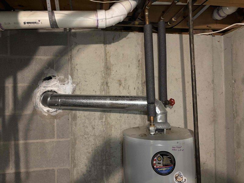 Inspected 18-year-old Bradford White water heater due to customer complaint of rapidly depleting hot water. Discovered significant sediment buildup in tank affecting heating efficiency. Performed system flush to remove accumulated sediment and restored proper hot water capacity.