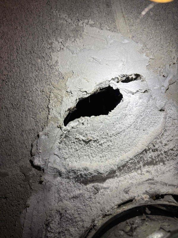 Inspected 18-year-old Bradford White water heater due to customer complaint of rapidly depleting hot water. Discovered significant sediment buildup in tank affecting heating efficiency. Performed system flush to remove accumulated sediment and restored proper hot water capacity.