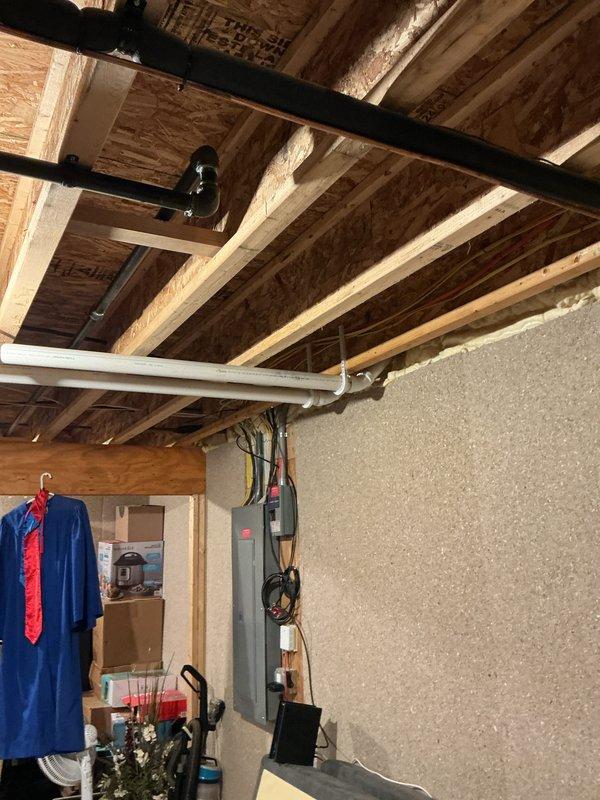 Performed a quoted repair on customer's tankless water heater system. Accessed unit in basement utility area, removed front panel for internal component inspection, and serviced the system connecting to both PVC venting and copper water lines. Successfully completed necessary repairs to restore proper functionality.