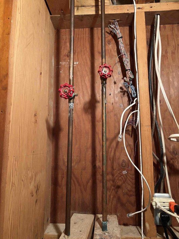 Successfully installed a new shut-off valve in the basement near the sump pump location. Completed copper pipe connections with appropriate fittings and secured the vertical pipe with a metal bracket against the concrete wall. All connections were tested for proper functionality and no leaks were detected.
