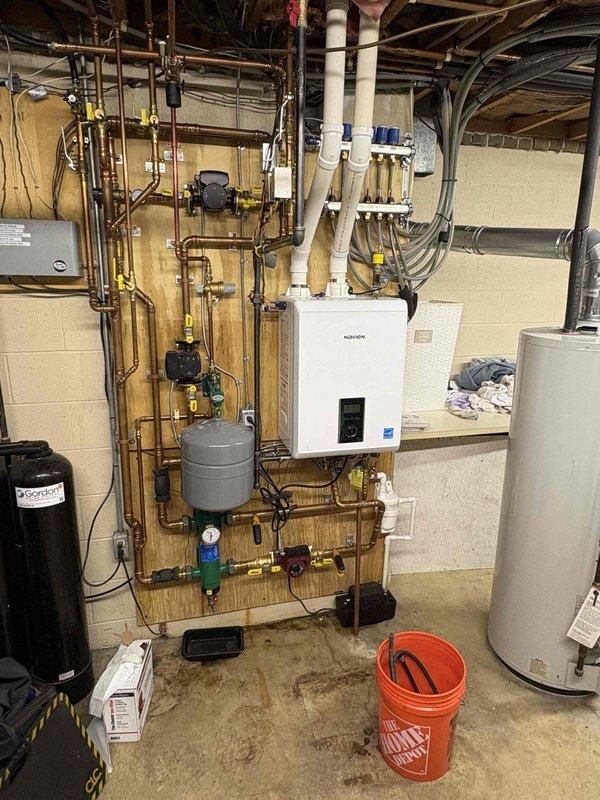 Responded to service call for a non-heating Navien WT 9-2030 boiler system. Upon inspection, found the circulation pump had failed, preventing proper water flow through the hydronic heating system. Replaced the defective pump, installed new isolation valves for easier future maintenance, and verified proper system operation with multiple heating cycles.