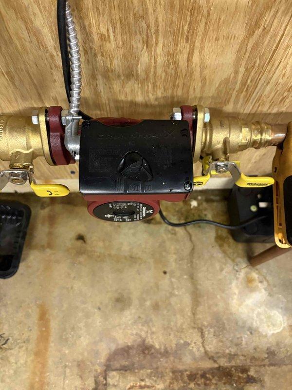 Responded to service call for a non-heating Navien WT 9-2030 boiler system. Upon inspection, found the circulation pump had failed, preventing proper water flow through the hydronic heating system. Replaced the defective pump, installed new isolation valves for easier future maintenance, and verified proper system operation with multiple heating cycles.