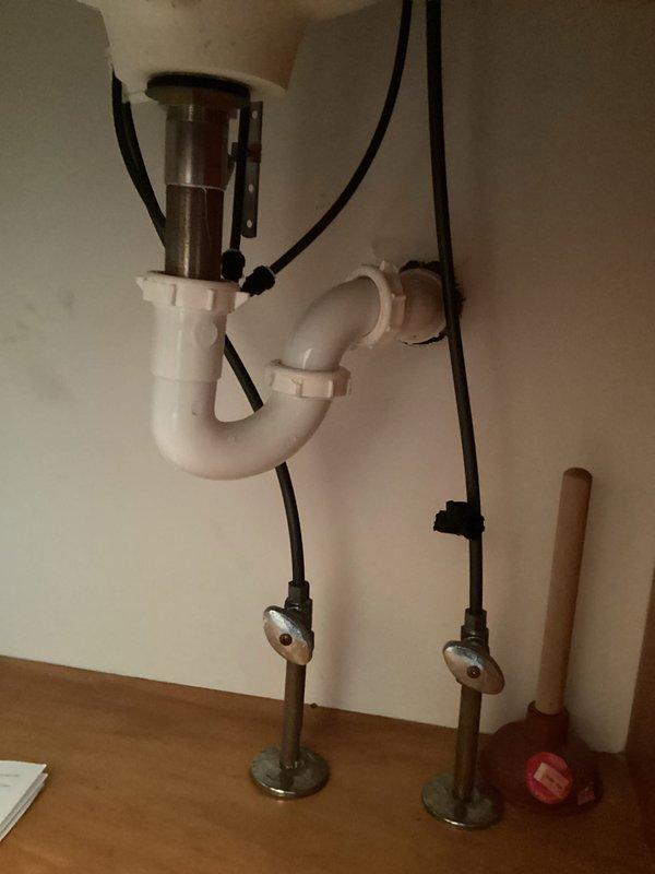 Responded to customer complaint of bathroom sink leak. Inspected the P-trap assembly and drain connections under the sink. Tightened loose connections at the tailpiece and trap adapter, resolving the leak issue without parts replacement. Verified proper drainage and absence of leaks after repair.