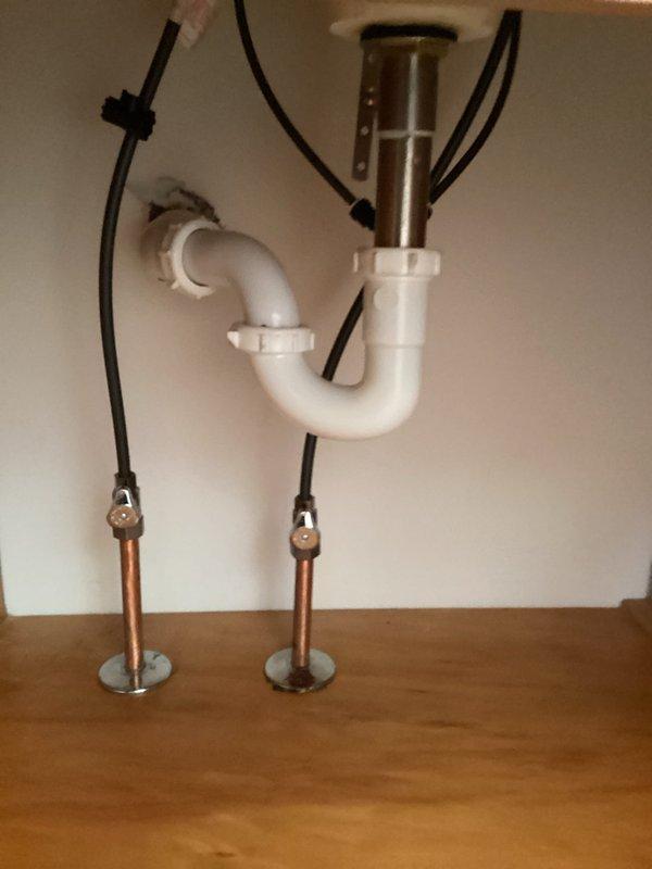 Responded to customer complaint of bathroom sink leak. Inspected the P-trap assembly and drain connections under the sink. Tightened loose connections at the tailpiece and trap adapter, resolving the leak issue without parts replacement. Verified proper drainage and absence of leaks after repair.