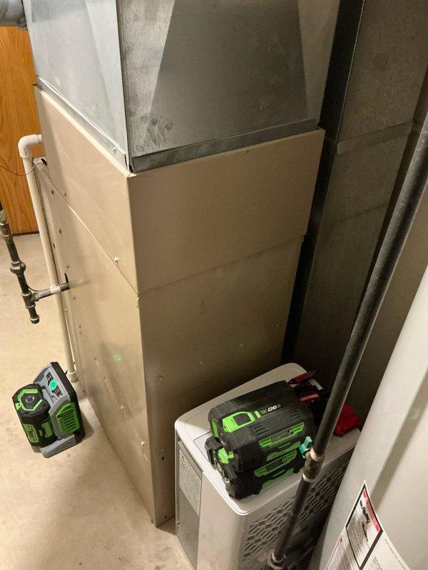 Completed estimate for replacement of 25-year-old furnace and air conditioning system per customer request. Documented existing HVAC equipment in basement mechanical room, including current connections and installation configuration. Also assessed outdoor unit location and surrounding concrete patio area for proper equipment placement considerations.