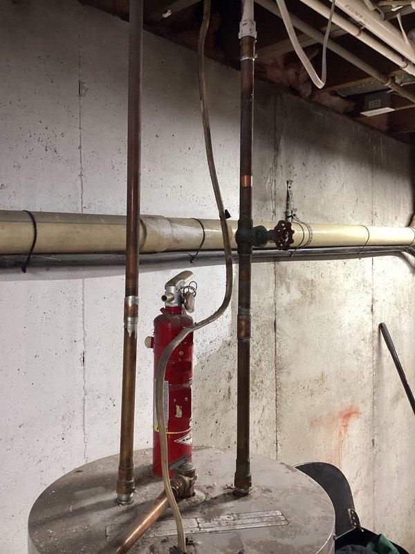 Completed assessment of existing water heater system and plumbing infrastructure to provide quote for water pump water heater replacement. Documented current installation with photos of PVC and copper piping configuration in utility area. Verified eligibility requirements for Consumers Energy rebate program and provided customer with detailed information on potential rebate amounts for the proposed installation.