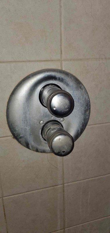 Inspected shower control system in master bath where overhead and body jets were non-operational. Discovered significant mineral buildup and wear on the shower valve assembly and diverter controls. Cleaned calcium deposits from valve components and adjusted water flow regulators to restore proper function to all jets.