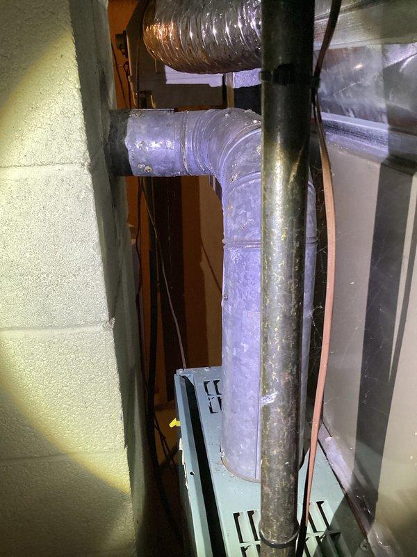 Performed annual tune-up on 39-year-old Coleman furnace. Inspected ductwork system, including flexible air ducts and connections, noting normal wear consistent with system age. No humidifier present; system appears to be functioning within normal parameters despite age.