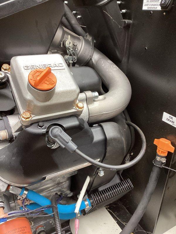 Performed annual tune-up service on Generac generator. Inspected internal mechanical components including fluid systems and connections. Checked oil level with dipstick and verified all hoses, pipes, and fasteners were in good condition with no visible leaks or damage.