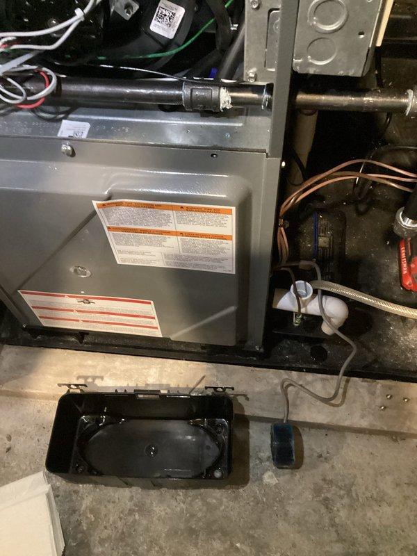 Performed scheduled annual heating tune-up on furnace system. Inspected condensate pump installation and verified proper operation with green indicator light active. Examined main HVAC unit with all electrical connections secure and no visible damage to components. System operating within normal parameters with drain pan properly positioned beneath unit.