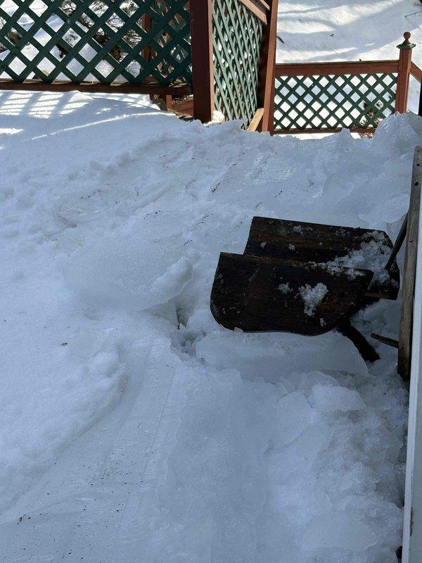 Inspected outdoor AC unit damaged by falling icicle. Unit is 0 years old with model ENE WT 7-2030. Documented damage with photos showing snow accumulation around the unit and surrounding area. Customer was informed of findings.