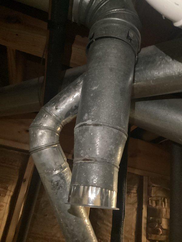 Responded to water leak complaint from furnace area. Upon inspection, found condensation buildup in the metal ductwork connected to the HVAC system. Identified water pooling at base of 10-year-old York furnace system, traced to improper drainage from condensate line. Cleared blockage, resealed duct connections, and verified proper operation with no further moisture issues.