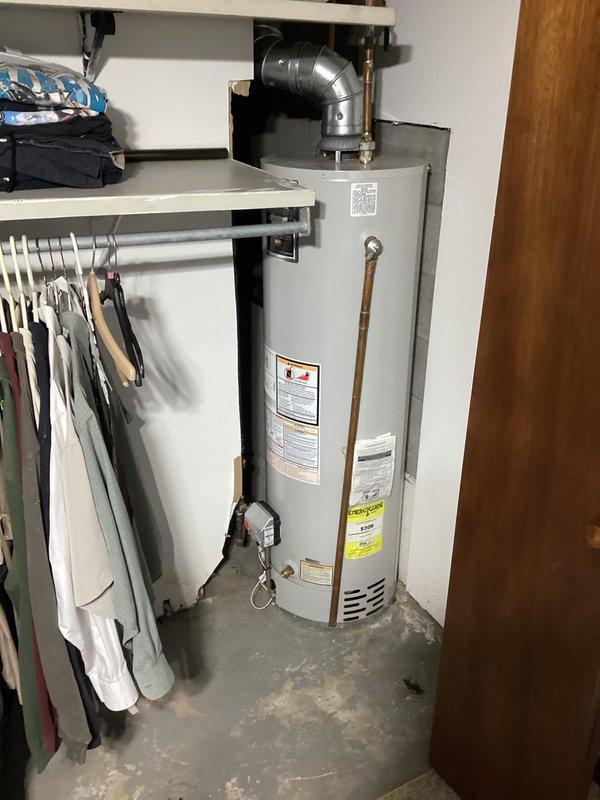 Diagnosed and repaired 3-year-old water heater with heating failure due to faulty valve. Performed comprehensive inspection of unit including ventilation system and surrounding plumbing connections, documenting current installation conditions with photos for service record.