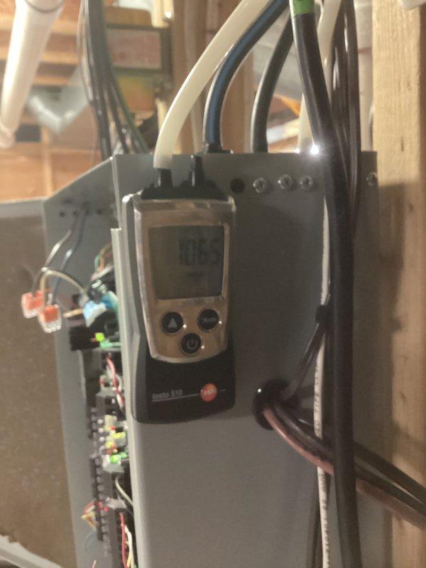 Performed annual heating tune-up on 21-year-old Goodman furnace. Inspected circuit board and electrical connections, finding dust accumulation inside casing. Conducted pressure testing with Testo 510 meter, recording readings of 0.05. Diagnosed airflow issues causing one room to receive no heat while another room had improper return/supply balance. Recommended follow-up for ductwork evaluation.