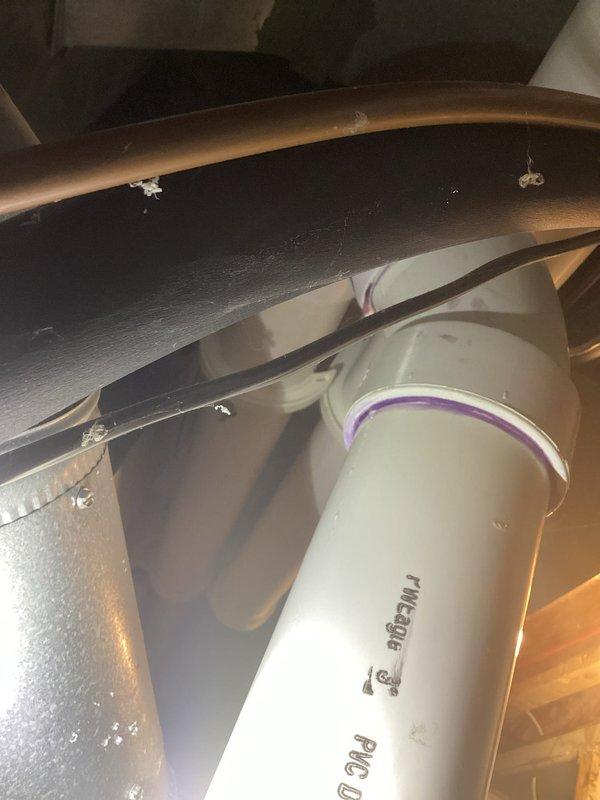 Completed annual heating service on Carrier furnace with humidifier (installed 2019). Inspected PVC plumbing components, including drainage system with proper purple primer at joints. Customer requested AC service scheduling during visit.