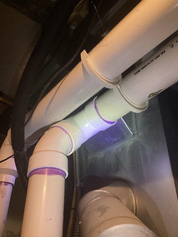 Completed annual heating service on Carrier furnace with humidifier (installed 2019). Inspected PVC plumbing components, including drainage system with proper purple primer at joints. Customer requested AC service scheduling during visit.