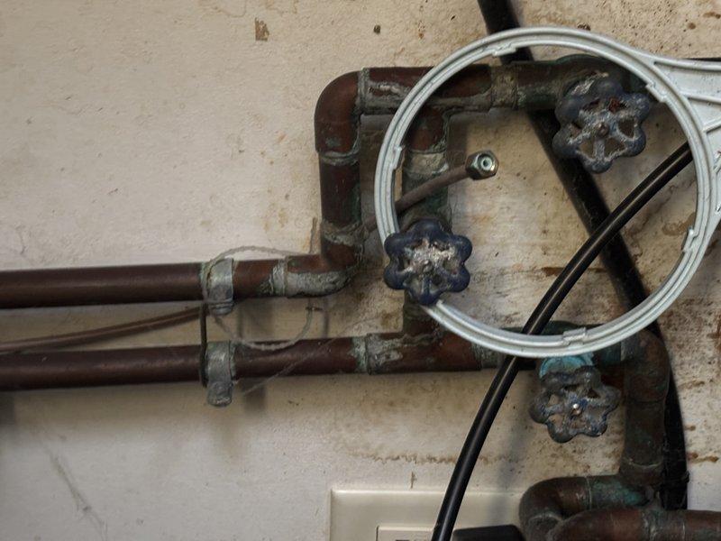 Performed annual heating system maintenance on 16-year-old furnace with integrated Aprilaire humidifier. Inspected copper plumbing connections showing normal oxidation and verified proper operation of valve handles despite visible wear. Humidifier was functioning correctly with appropriate ducting connections and control settings adjusted for winter operation.