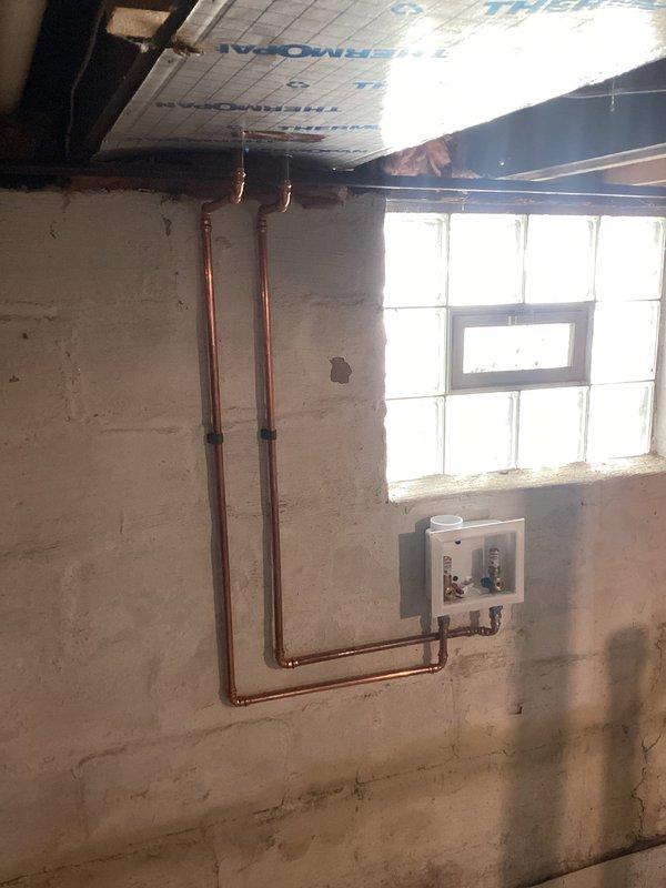 Installed new gas line, water lines, and dryer vent in basement utility area per QUOTR specifications. Completed all necessary plumbing connections with proper fittings, including copper water supply lines and PVC drainage components, ensuring code-compliant installation for dryer setup. All connections tested for proper function and integrity before completion.