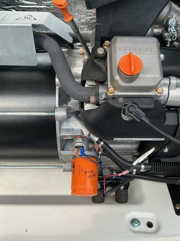 Performed scheduled 2-year tune-up on Generac generator system, inspecting all major components including engine housing, fuel system, and control panel. Checked and verified proper operation of safety indicators, examined intake/cooling system hoses for integrity, and confirmed all mounting hardware was secure with no visible damage or wear issues.