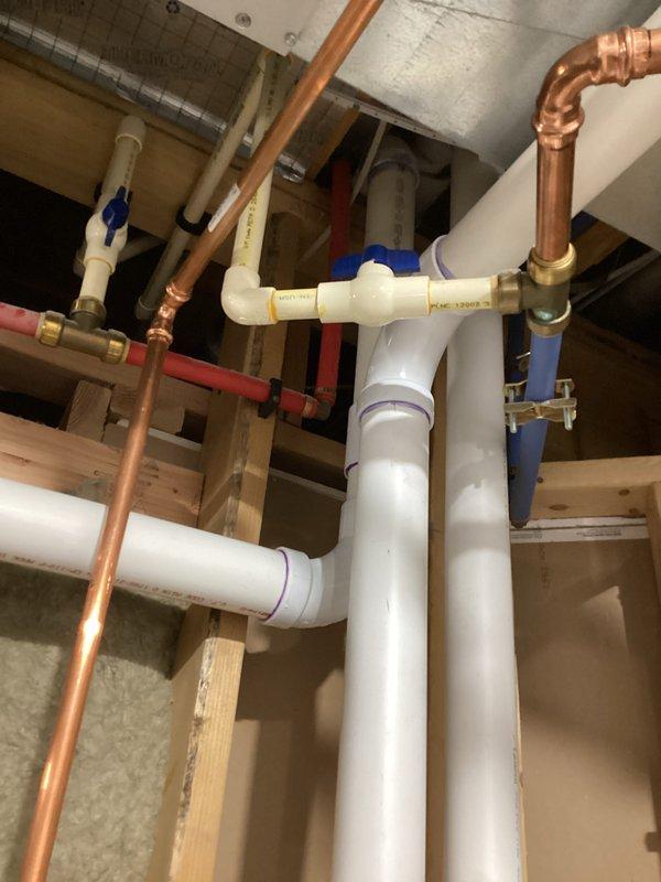 Successfully completed installation of new furnace system. Work included proper connection of copper supply lines and PVC drainage components with appropriate fittings and valves. All plumbing infrastructure was properly mounted against framing with insulation maintained for optimal system performance.