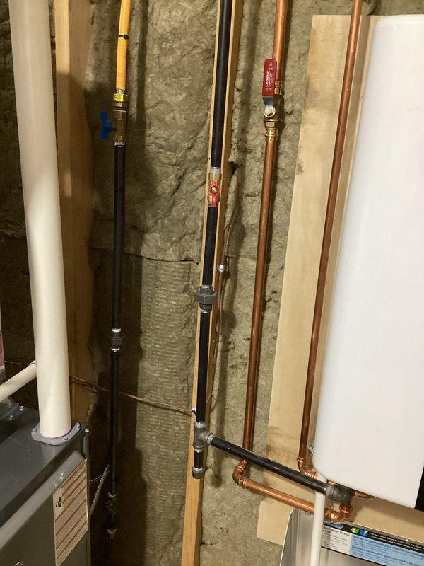 Successfully completed installation of new furnace system. Work included proper connection of copper supply lines and PVC drainage components with appropriate fittings and valves. All plumbing infrastructure was properly mounted against framing with insulation maintained for optimal system performance.