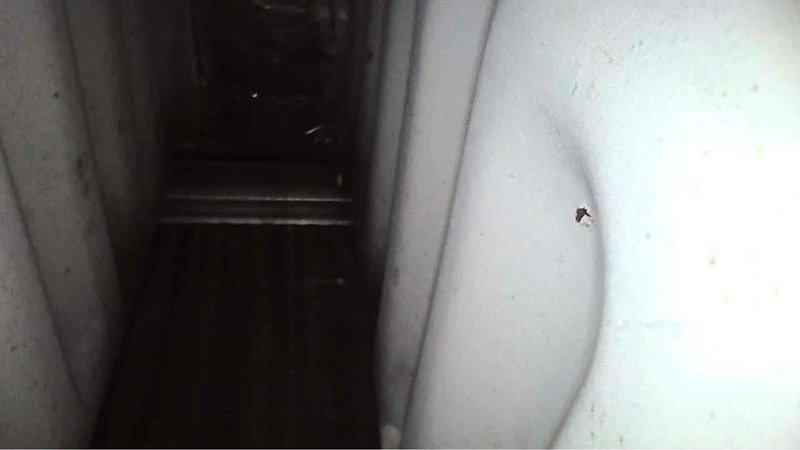 Responded to service call for a Carrier furnace displaying error code 31. Upon inspection of the 12-year-old unit in a confined space, found the furnace was still operational despite the error code. Documented the condition with photos of the interior components and surrounding mechanical space for future reference.