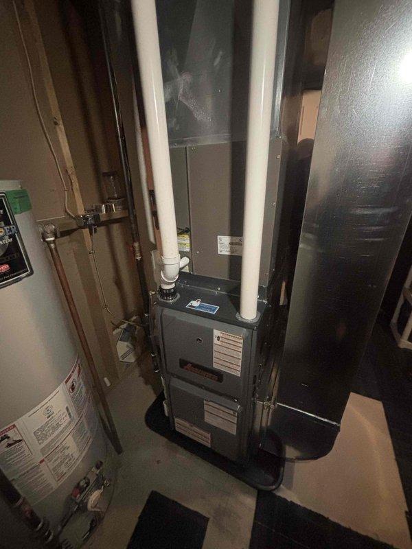 Successfully installed new furnace unit in utility room. System includes proper PVC intake/exhaust ventilation and connects to existing ductwork. All connections secured and system tested for proper operation upon completion.