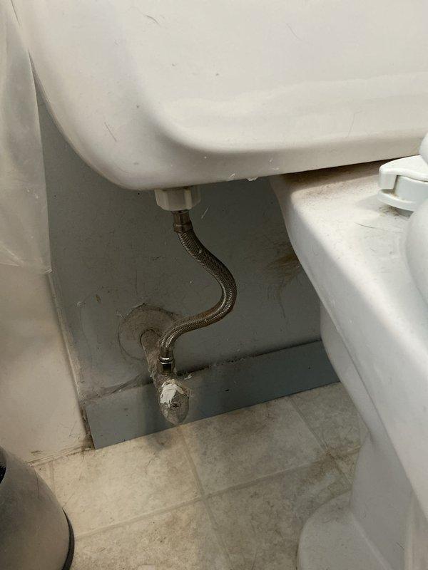 Successfully installed new toilet, connecting supply line to existing shut-off valve and securing unit to floor. Observed bathtub drainage issues and problematic stopper mechanism, which will require separate service appointment for resolution.