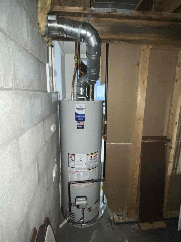 Successfully installed new water heater in utility area, connecting all required copper pipes and fittings. Properly secured ventilation ductwork with appropriate 90-degree bend for exhaust. Confirmed all connections are leak-free and unit is functioning according to manufacturer specifications.