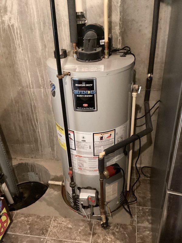 Responded to service call for 10-year-old Bradford White water heater not producing hot water. Diagnosed issue with the Defender Safety System and repaired the unit, restoring proper hot water function to the residence.