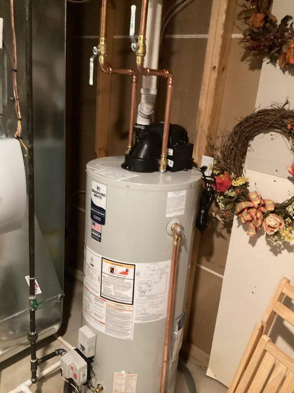 Successfully installed a new 40-gallon, natural gas water heater with power vent and 10-year warranty in customer's utility room. Unit was properly connected to existing copper plumbing lines with appropriate valves and fittings. Complete installation included all necessary safety checks and operational testing.