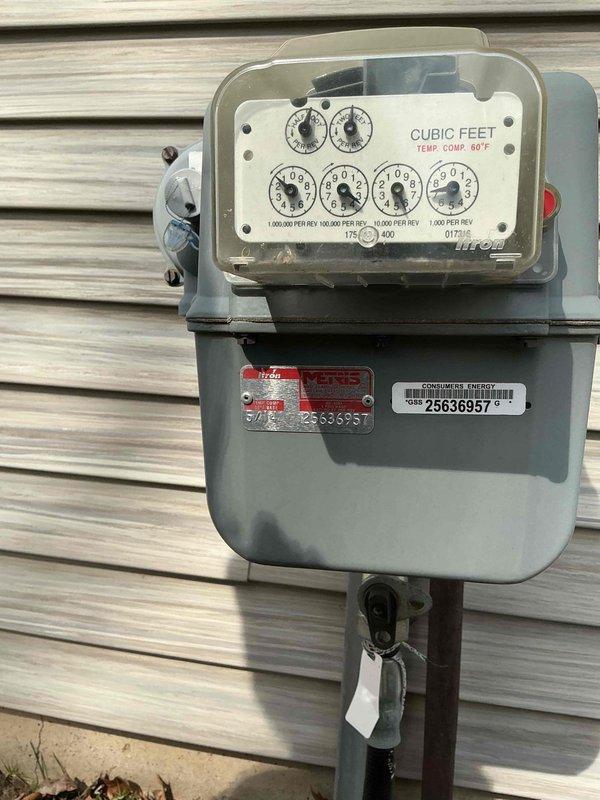 Conducted site assessment for whole house generator installation at 26-year-old residence. Inspected existing natural gas meter (serial #25636957) to evaluate gas supply capacity. Examined potential installation location in garage/storage area with unfinished OSB walls and partially completed drywall ceiling. Photos documented current conditions for proper system sizing and installation planning. Quote pending based on collected specifications.