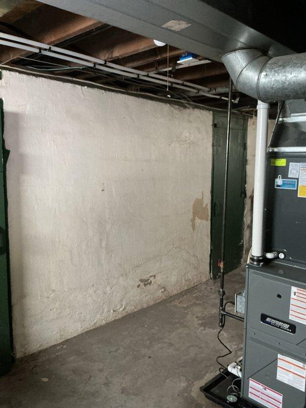 Cleared kitchen sink drain line obstruction that was causing slow drainage in 100-year-old home. Inspected under-sink P-trap assembly and verified proper function. Traced drainage issue to main waste line and cleared blockage, restoring normal drainage flow.