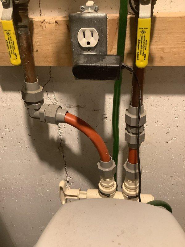 Responded to service call for Kenmore water softener showing excessive water levels. Diagnosed issue with control valve causing improper cycling during regeneration. Reset system and verified proper operation through manual regeneration cycle. System now functioning correctly with normal water levels and displaying appropriate readings on digital control panel.