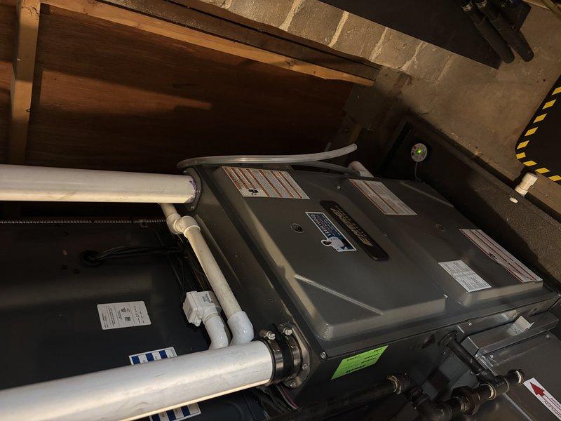 Completed annual heating maintenance on furnace system. Inspected all components including PVC ventilation/drainage lines and confirmed proper operation. No humidifier present on this Club membership service as noted in work order (ENE-WT-11-2033).