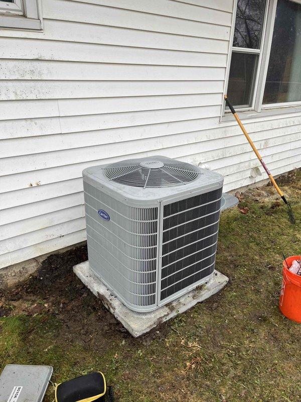 Successfully installed new HVAC system including Carrier outdoor AC unit positioned on concrete pad and AirEase furnace with integrated humidifier in utility area. Complete installation included all necessary ductwork connections and system testing to ensure proper functionality.